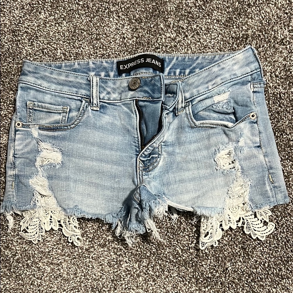 Blue Distressed Jean Shorts with Angled Cut